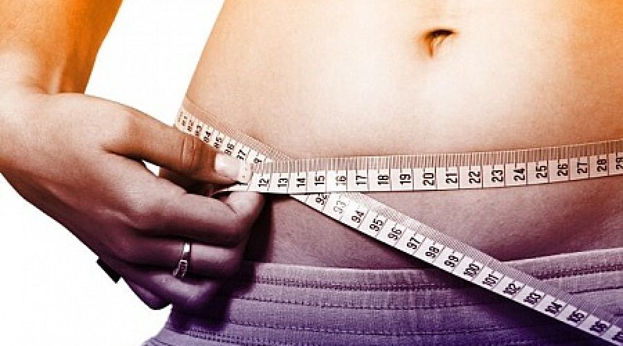 woman-measuring-waistline--how-to-lose-weight-fast
